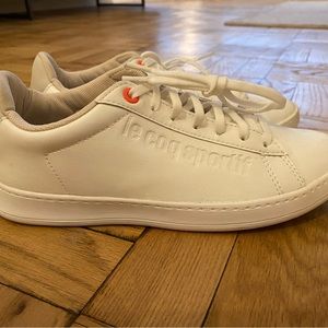 Le Coq Sportif white leather low-top tennis sneaker. Women’s size 7. Never worn.